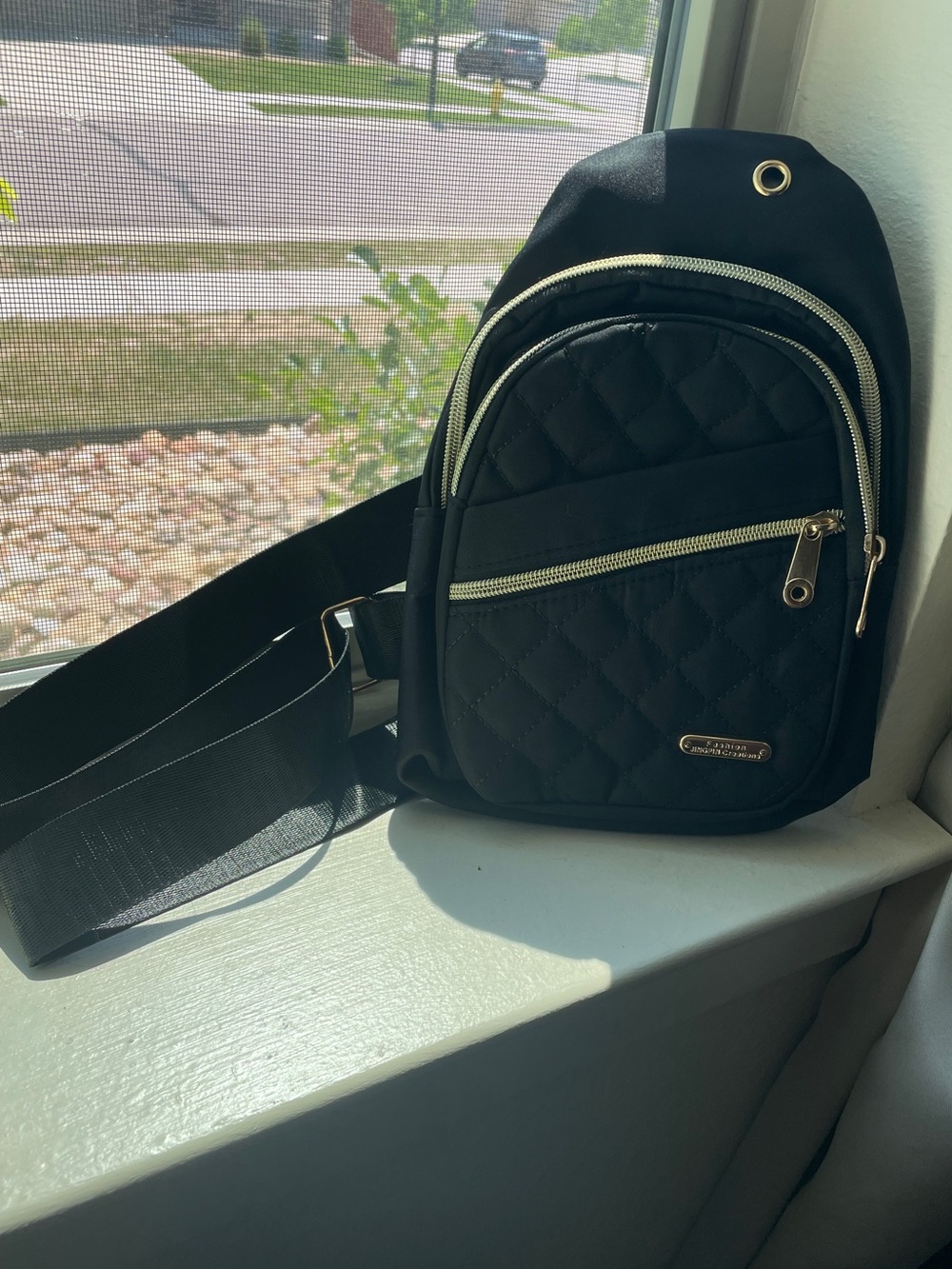 Amazon Black Quilted Sling Backpack with Gold Zippers